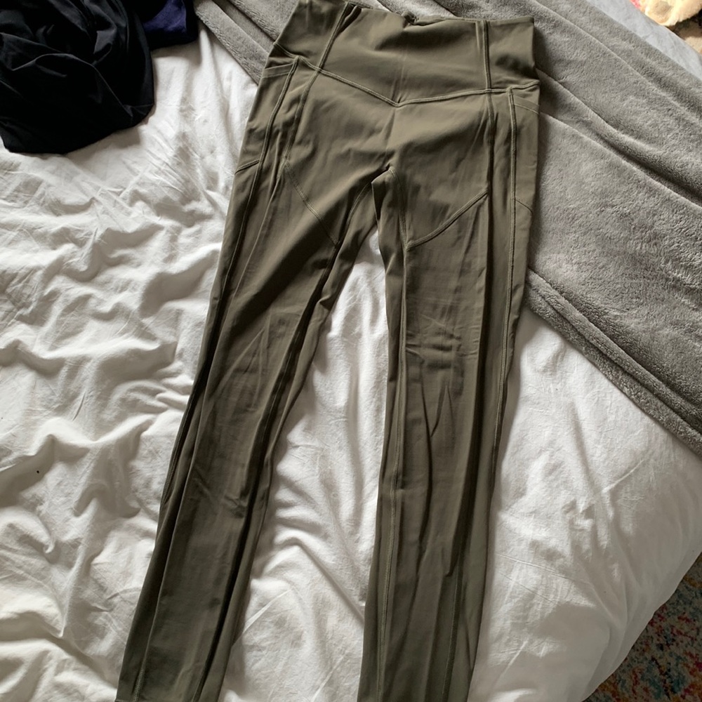 army green lululemon leggings. small hole in crotch area.